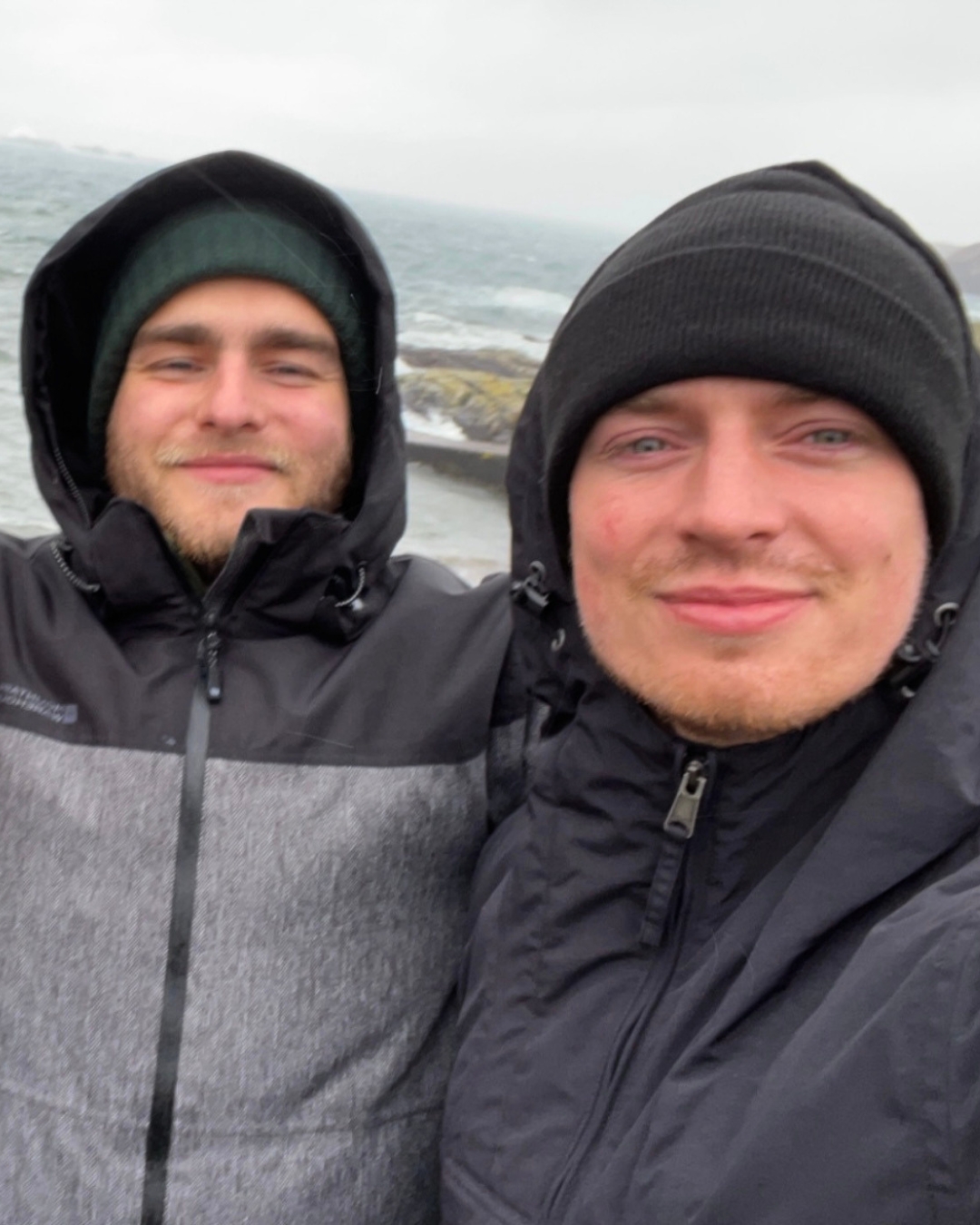 Dean and Rob together by the coast in Scotland